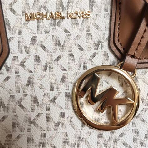 michael kors 1209|Michael Kors metal logo.